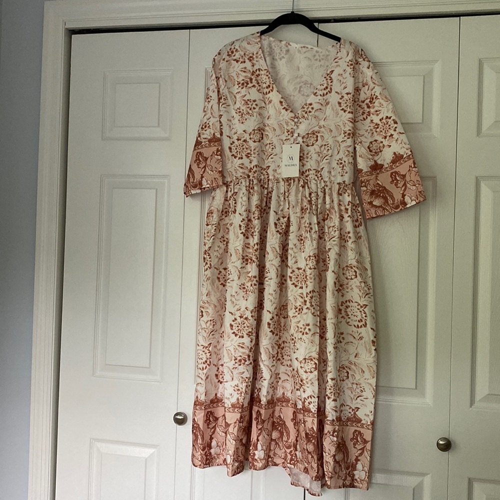 Light cream dress, very generous in fit